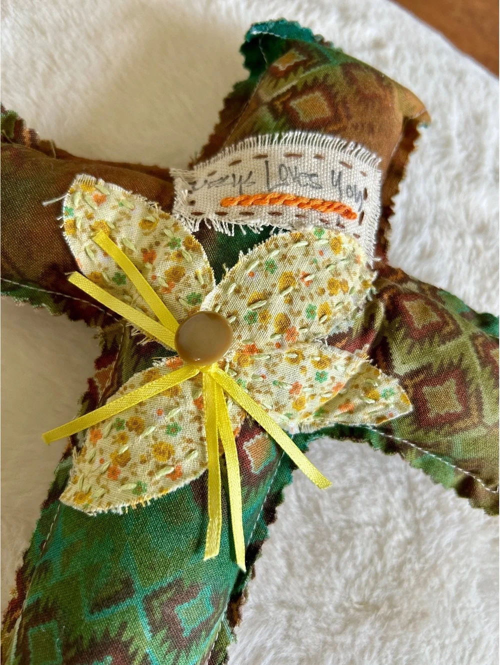 Handcrafted Decorative Fabric Cross with Floral Accent and 'Jesus Loves You' Tag